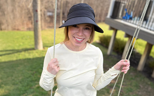 Leah wears a Solbari visor and t-shirt